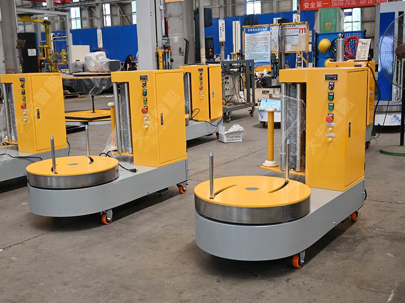 行李缠绕膜包装机.jpg 行李缠绕膜包装机.jpg