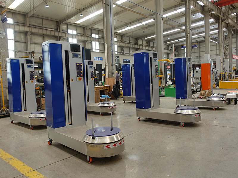 机场行李打包遇难题？这款行李缠绕机给出高效解决方案