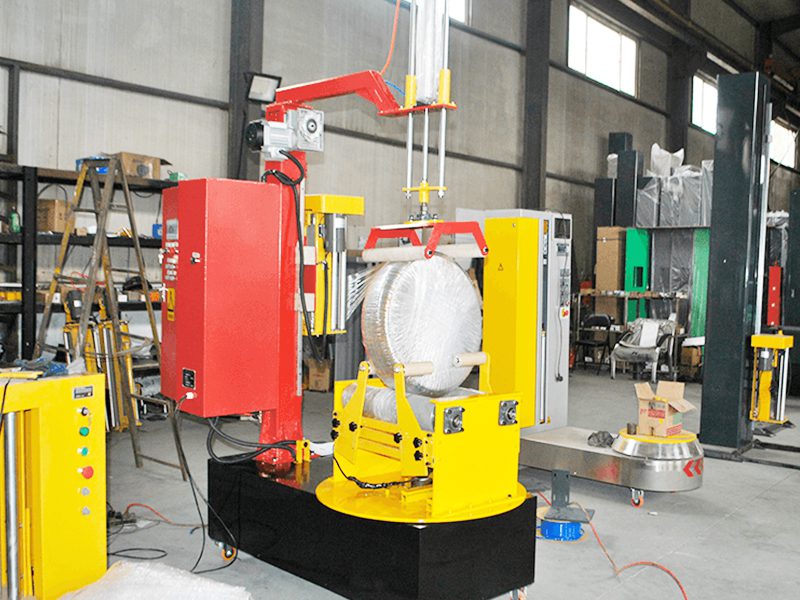 布卷、线圈、纸筒怎么包才不散？小型圆筒式缠绕包装机全包一圈更稳