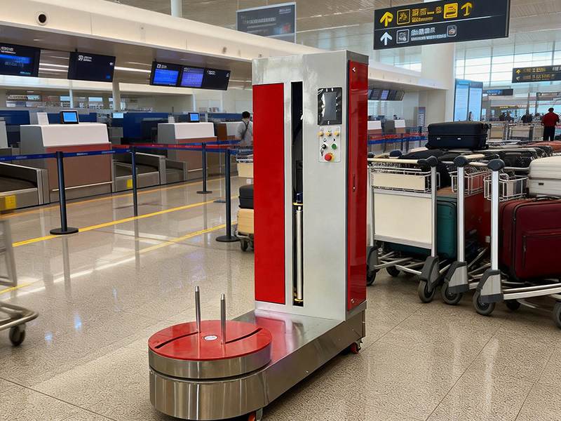 机场行李打包机实现行李托运外层自动包覆