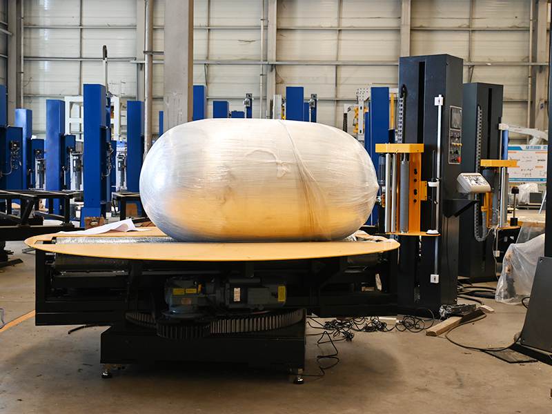 卷筒纸外包装缠膜机在纸卷运输防